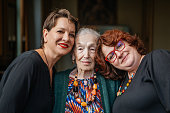 Portrait of elegant 97 year old woman and her granddaughters