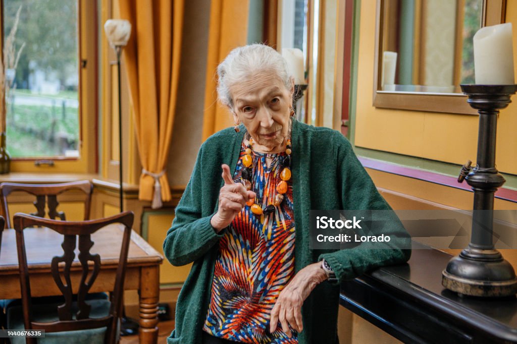Portrait of elegant 97 year old woman in a drawing room Senior Women Stock Photo