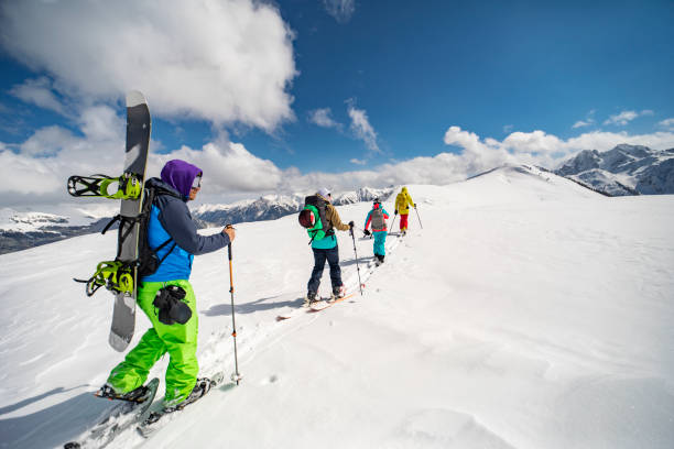 istock Group of people going back country skiing 1440678481