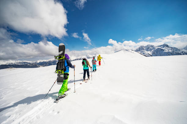 istock Group of people going back country skiing 1440678482