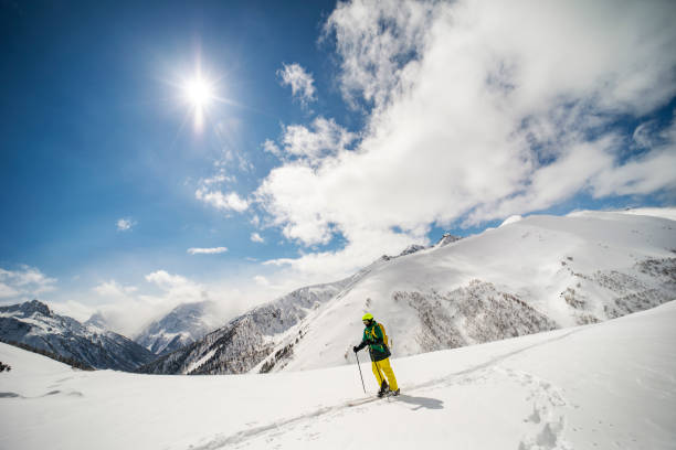 istock Young adult man going back country skiing 1440678490