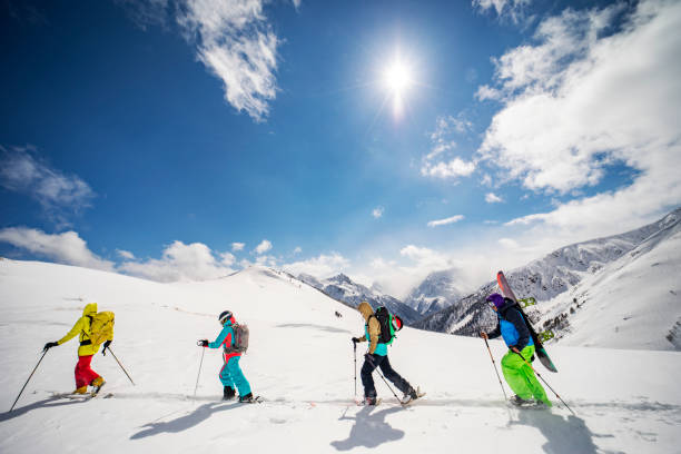 istock Group of people going back country skiing 1440678494