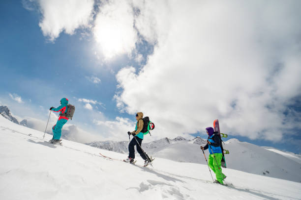 istock Group of people going back country skiing 1440678532