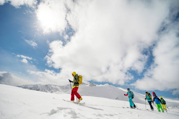 istock Group of people going back country skiing 1440678560