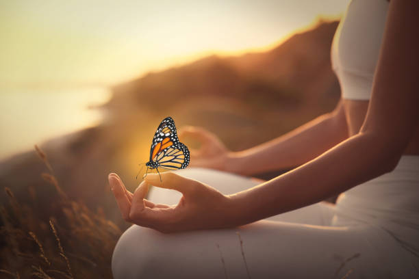 istock Woman meditating outdoors at sunset, closeup view 1440679690