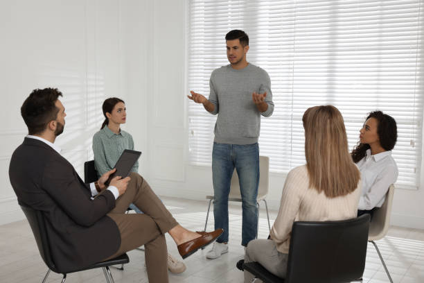 istock Psychotherapist working with patients at group session indoors 1440679776