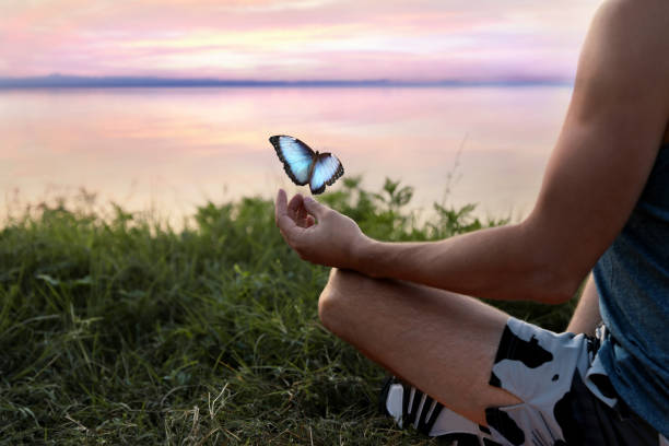 istock Man meditating near river, closeup. Space for text 1440679885