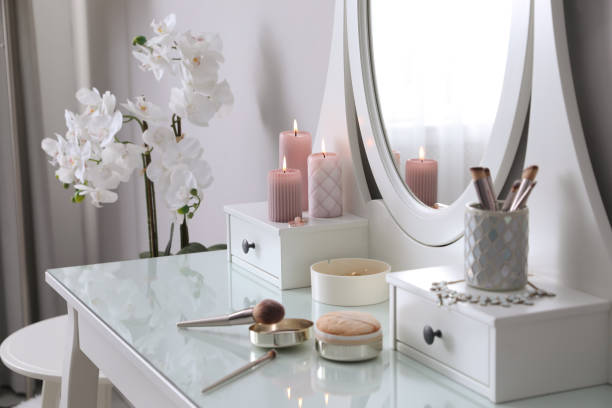 istock Wooden dressing table with decorative elements and makeup products in room 1440680092