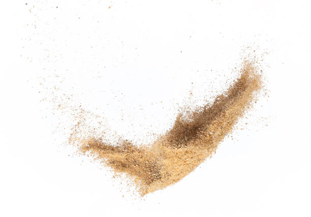 istock Sand flying explosion, Golden sand wave explode. Abstract sands cloud fly. Yellow colored sand splash throwing in Air. White background Isolated high speed shutter, throwing freeze stop motion 1440681431