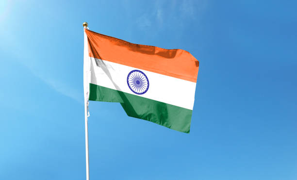 istock Indian flag on cloudy sky. waving in the sky 1440681463