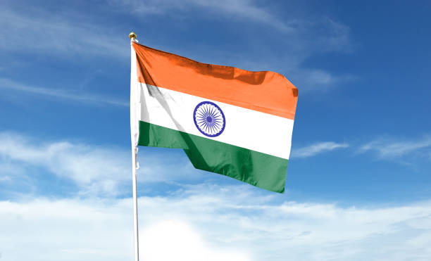 istock Indian flag on cloudy sky. waving in the sky 1440681751