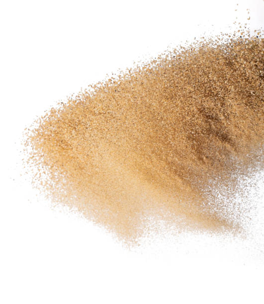 istock Sand flying explosion, Golden sand wave explode. Abstract sands cloud fly. Yellow colored sand splash throwing in Air. White background Isolated high speed shutter, throwing freeze stop motion 1440682668