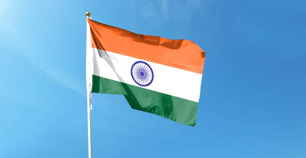 istock Indian flag on cloudy sky. waving in the sky 1440682743