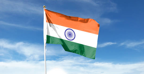 istock Indian flag on cloudy sky. waving in the sky 1440682898