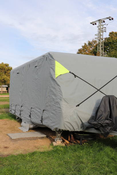 istock a caravan with a gray tarpaulin 1440683920