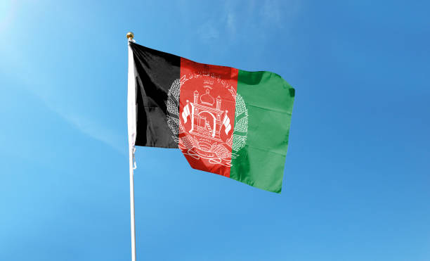 istock Afghanistan flag on cloudy sky. waving in the sky 1440684478