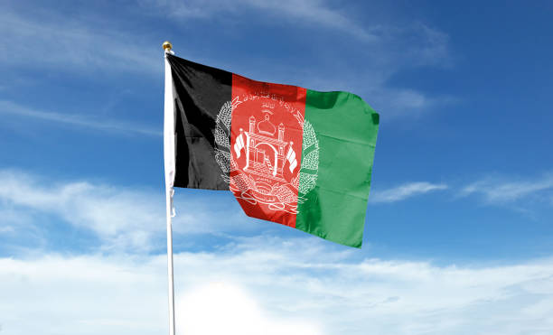 istock Afghanistan flag on cloudy sky. waving in the sky 1440684627