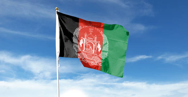 istock Afghanistan flag on cloudy sky. waving in the sky 1440684660
