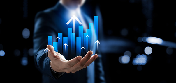 Businessman showing business growth graph, successful marketing strategy, up arrow and global market analysis.