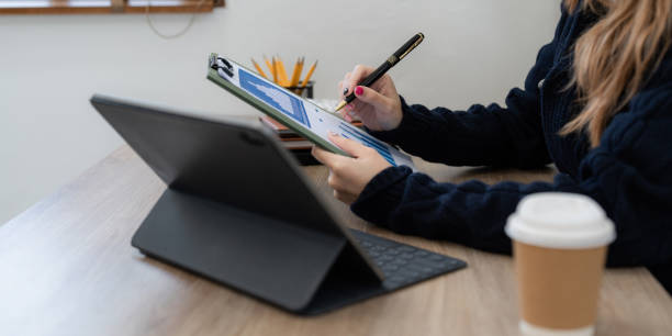 istock Asian woman working with laptop at home. work from home concept 1440689314
