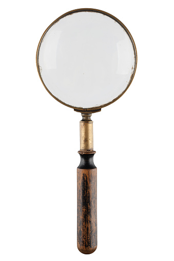 Retro vintage magnifying glass isolated on white background