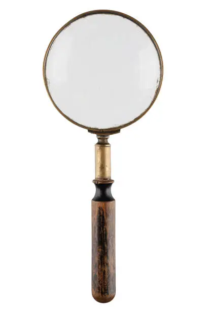 Photo of Retro vintage magnifying glass isolated on white background