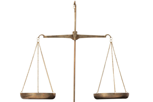 Bronze traditional balance scale isolated on white background.