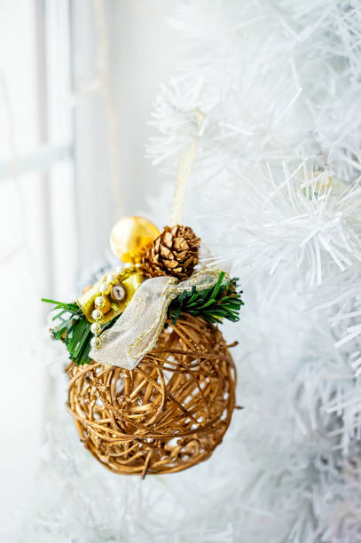 istock Christmas tree toy woven from a vine. Christmas background with space for text, Christmas tree in the snow, wooden bright Christmas ball 1440689456