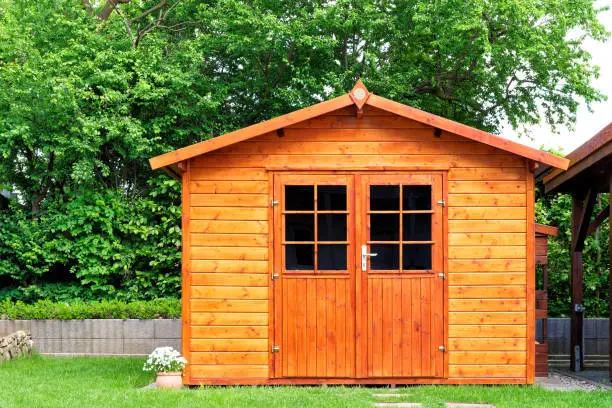 Photo of Frontal view of wooden garden shed