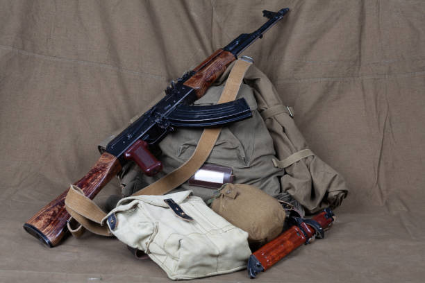 istock Mobilization in russia 2022. Kalashnikov gun with primitive WW2 pattern soviet army equipment. 1440690593