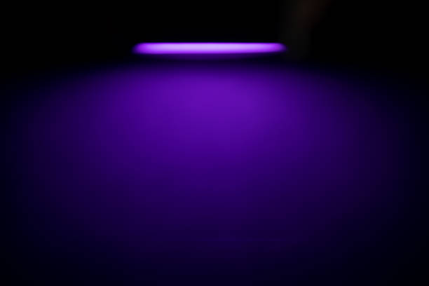 istock abstract background with bright lights, product showcase with studio background spotlights. 1440696506