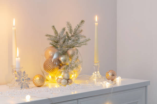 istock christmas decoration with burning candles in white interior 1440697558