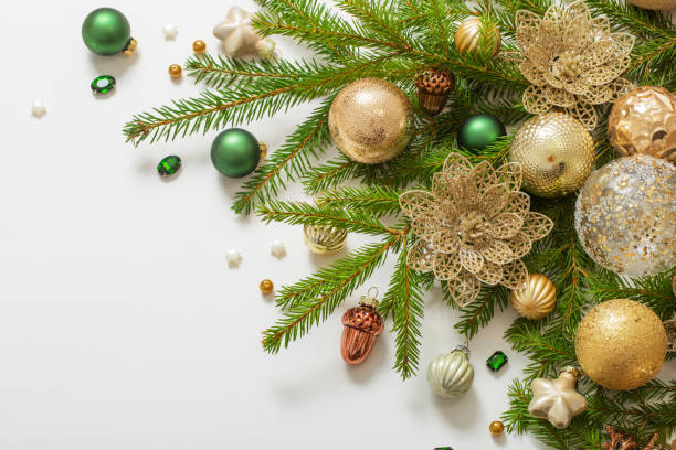 istock golden and green  christmas decorations  on white  background 1440697603
