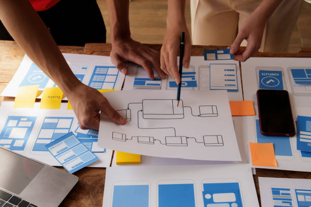 istock Group of ux developer and ui designer brainstorming about app interface design at modern office. Creative digital development agency. 1440697950