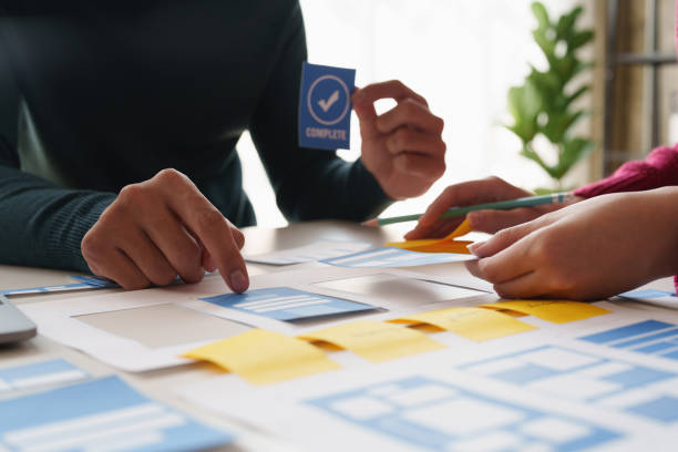istock Group of ux developer and ui designer brainstorming about app interface design at modern office. Creative digital development agency. 1440698204