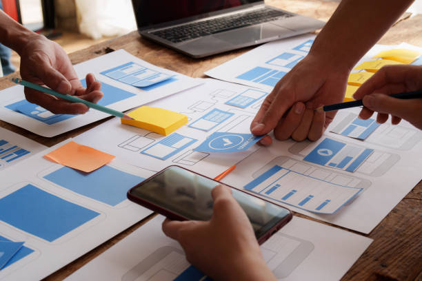 istock Group of ux developer and ui designer brainstorming about app interface design at modern office. Creative digital development agency. 1440699093