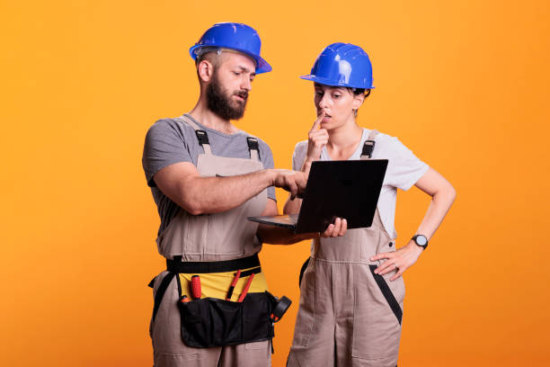 istock Renovators team holding laptop and browsing internet 1440699592