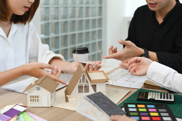 istock Image of Architects or interior designer team selecting ceramic stoneware and marble samples for built-in furniture design. 1440699854