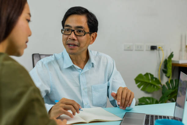 istock Financial Advisor talking to client at home. 1440700959