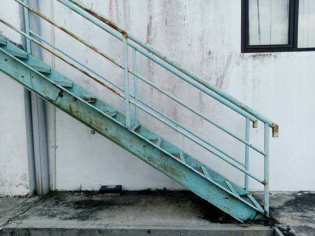 istock white building walls with windows and iron stairs. 1440701133