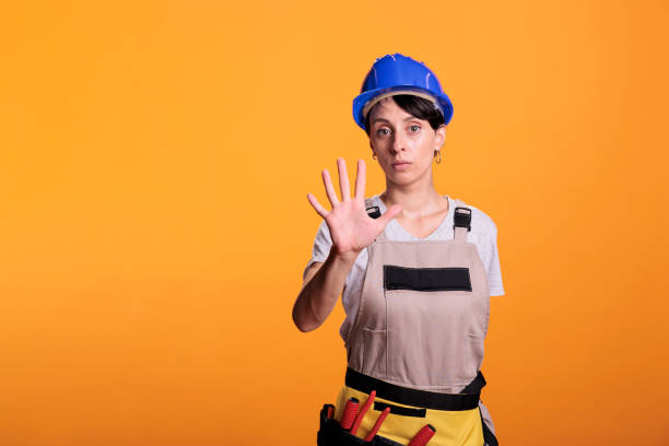 istock Young handywoman disapproving rejecting idea 1440702005