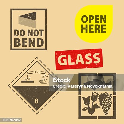 istock Set of fragile sticker  and case glass icon packaging symbols sign, open here and do not bend rubber stamp on cardboard background. Use on package. 1440702042