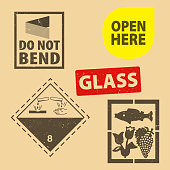 istock Set of fragile sticker  and case glass icon packaging symbols sign, open here and do not bend rubber stamp on cardboard background. Use on package. 1440702042