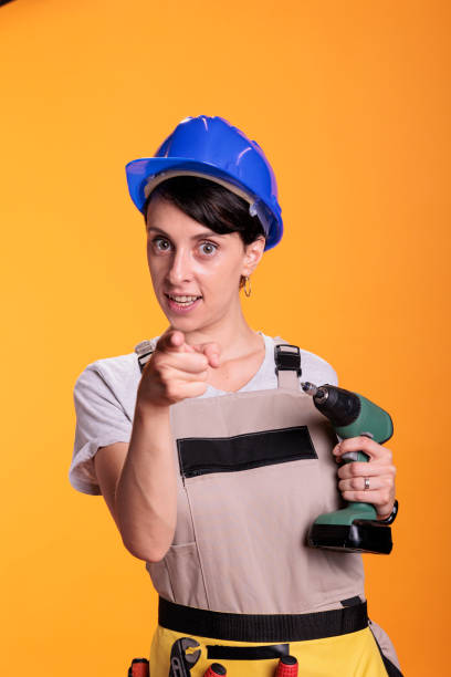 istock Woman construction worker pointing index finger at camera 1440702087