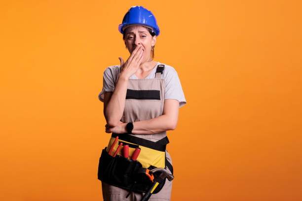 istock Sleepy overworked builder yawning and feeling tired 1440702102