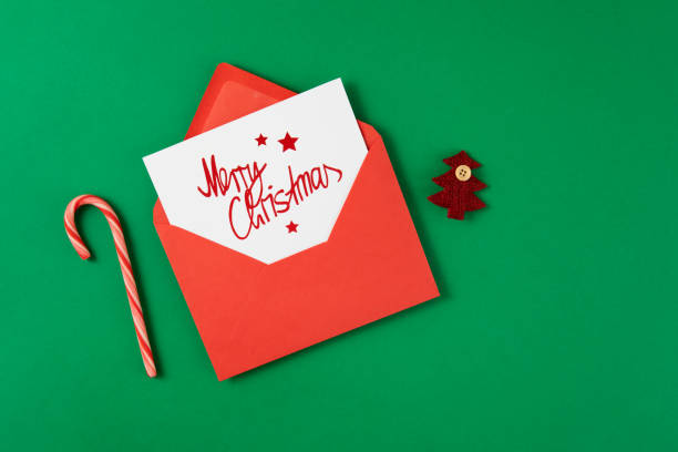 istock Red Envelope with Greeting Card for Winter Holidays with Candy Canes 1440702163