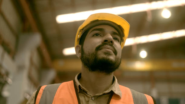 istock Workers in a factory making roof sheets 1440702269