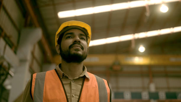 istock Workers in a factory making roof sheets 1440702272