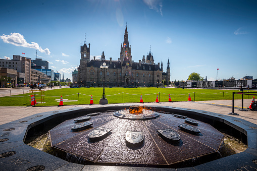 Ottawa, Canada - August 19, 2022: View to Ottawa Parliament Building and Cennential Flame. Ottawa is the capital city of Canada.