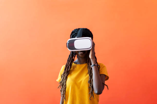 istock Black young woman in virtual reality glasses 1440704922